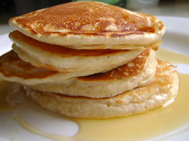 Buttermilk pancakes with butter and fresh maple syrup