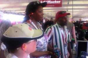 Heather Fink, Sheila Lollis and Ed Lollis watch as cars are prepped for the race