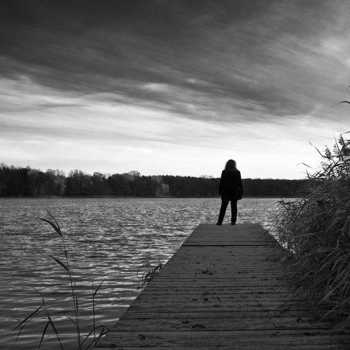 Woman, Sunset, Sea and Silence