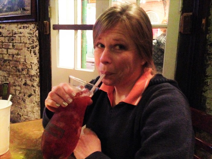 Heather drinks a Hurricane at Pat O'Brien's