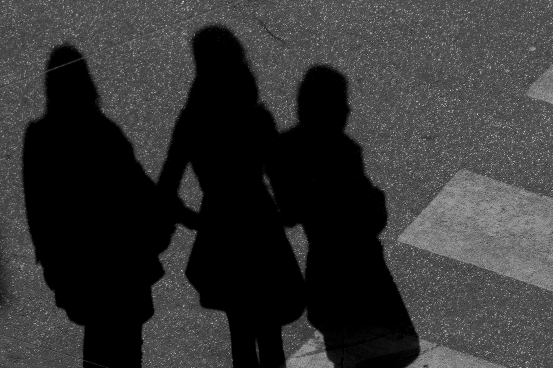 Three women in shadow