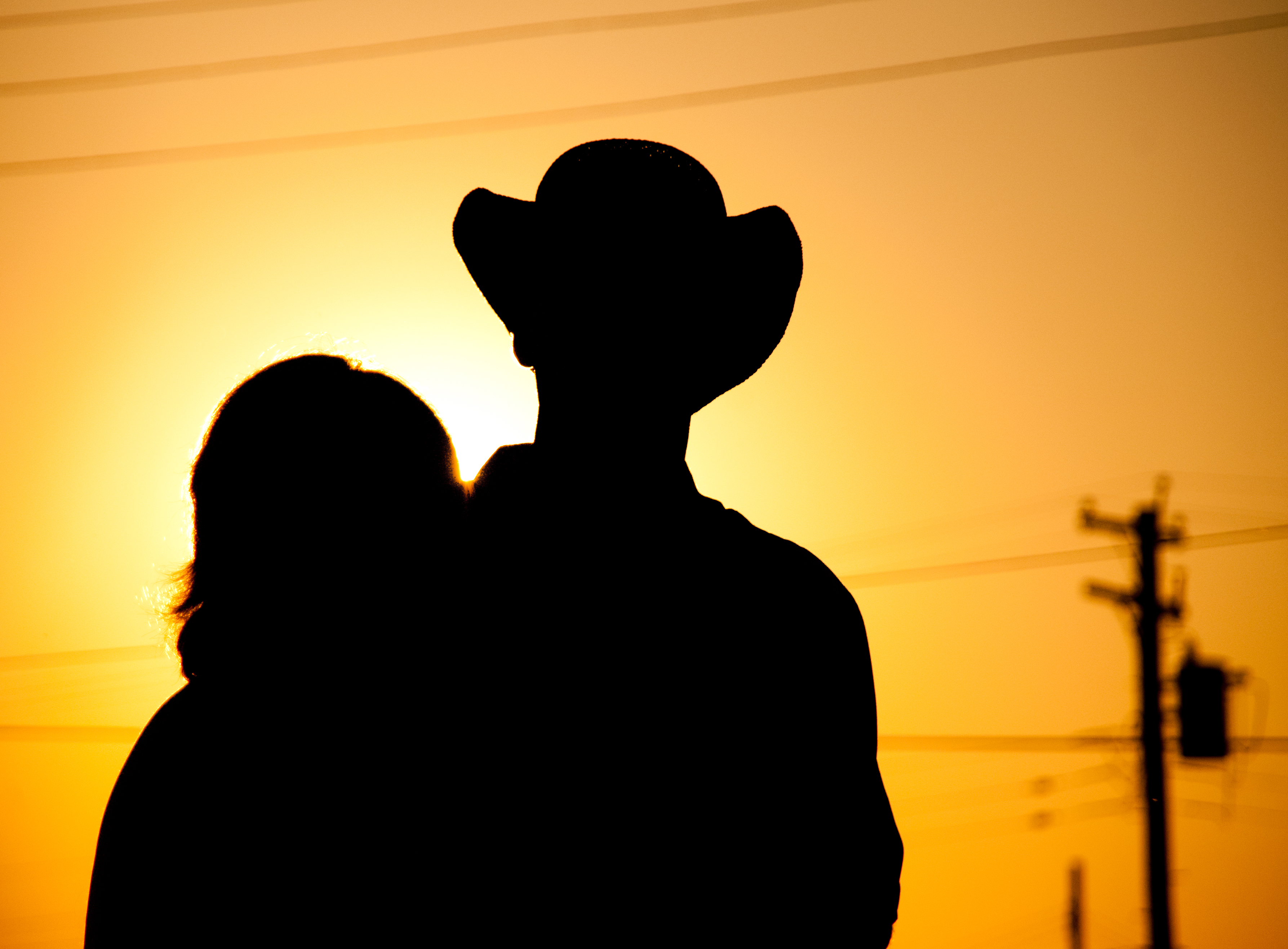 Cowboy and his girl at sunset