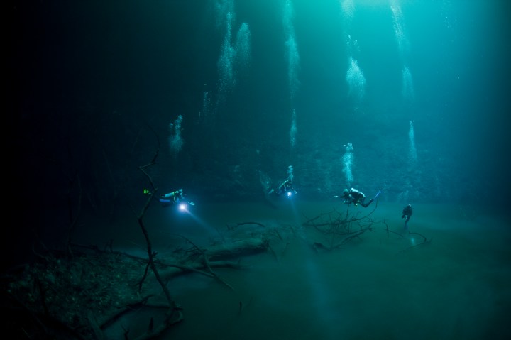 Divers in an underwater cave