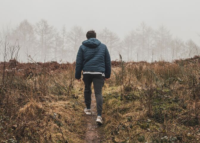 Man walking in meadow
