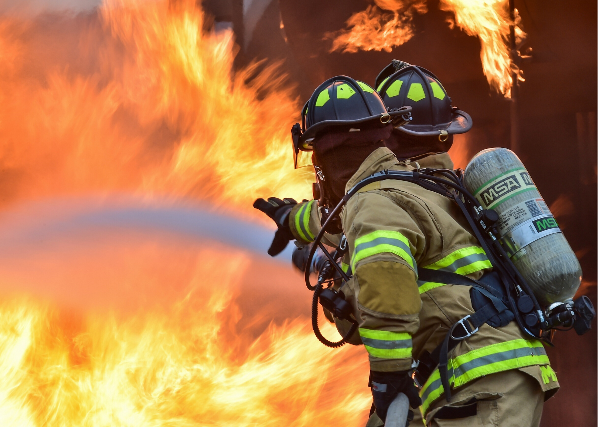 Firemen hosing down a fire