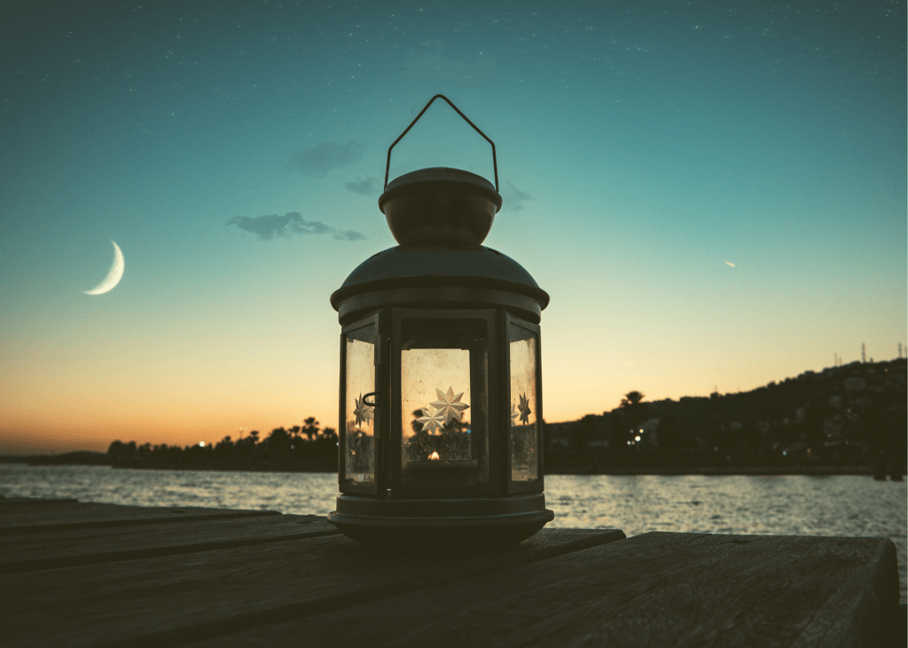 Gray metal candle lantern on boat dock