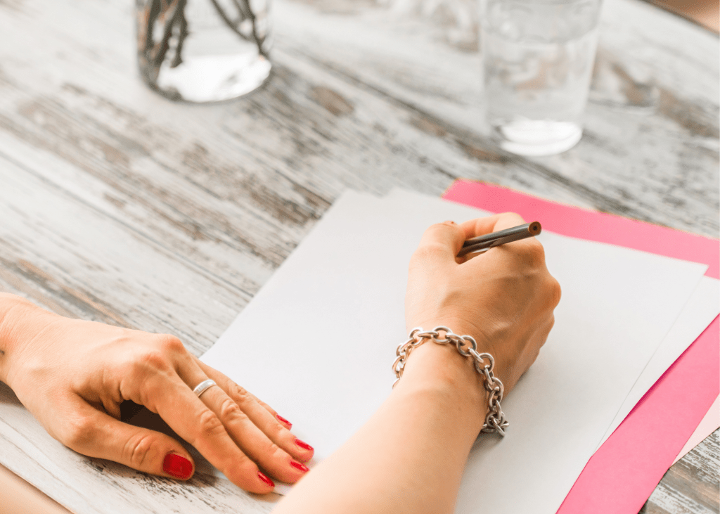 Woman writing on paper